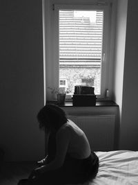 Rear view of man looking at home