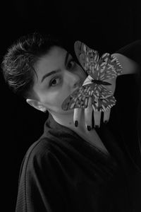 Close-up portrait of young woman looking away