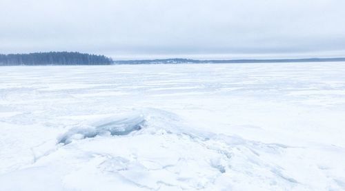 Scenic view of frozen lake against sky