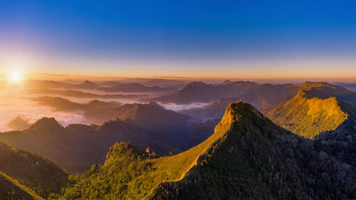 Panoramic view of mountains against sky during sunset