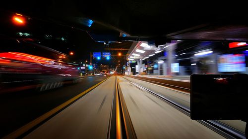 Light trails on road in city at night