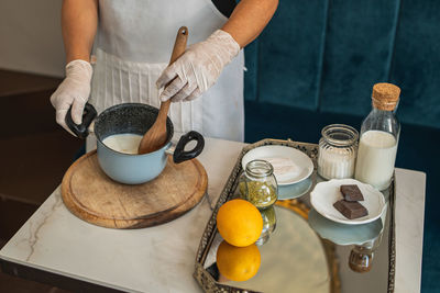 High angle view of person preparing food on table