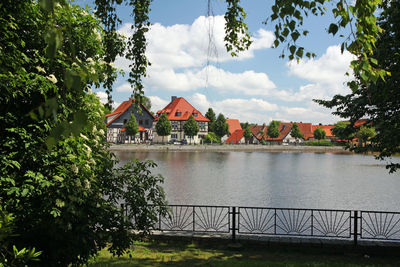 View of lake against cloudy sky