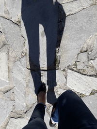 Low section of man standing on floor
