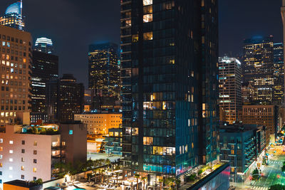 High angle view of illuminated buildings in city at night