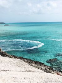 Scenic view of sea against cloudy sky