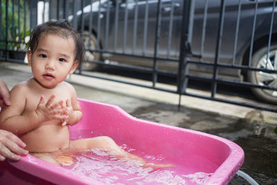 Portrait of shirtless boy in water