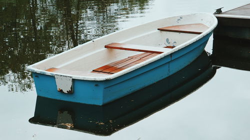 Boat moored in lake