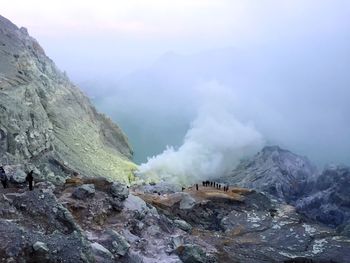 Scenic view of volcanic mountain against sky