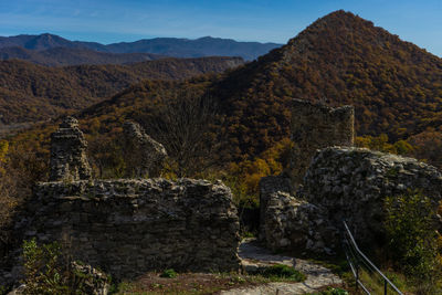 View of stone wall with mountain in background