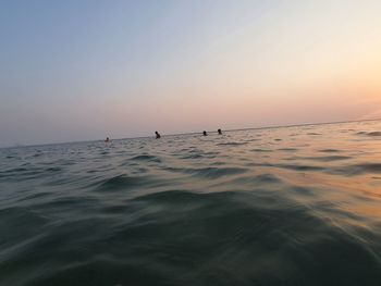 Scenic view of sea against clear sky during sunset