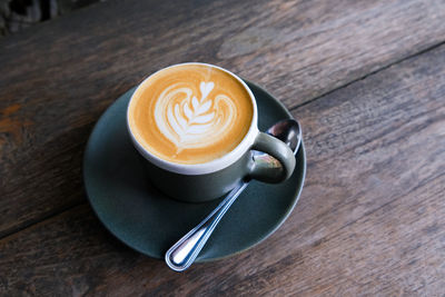 Close-up of cappuccino on table