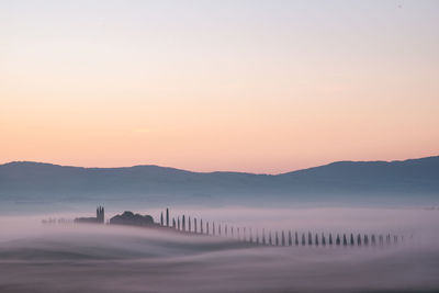 Foggy sunrise view of poggio covili