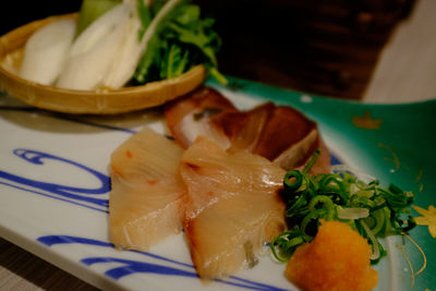 Close-up of sashimi served in plate on table