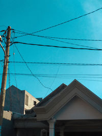 Low angle view of cables against sky