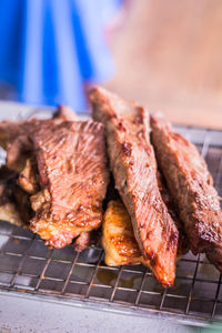 High angle view of meat on barbecue grill