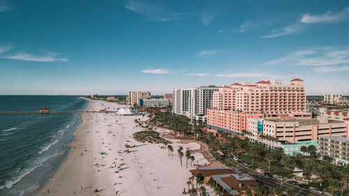 Panoramic view of beach and buildings against sky