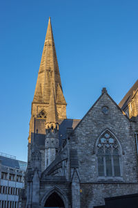 Low angle view of building against clear blue sky