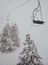 Low angle view of ski lift against sky