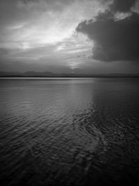 Scenic view of sea against sky at dusk