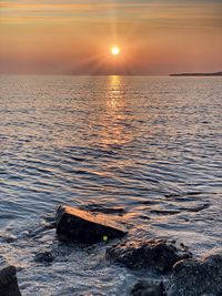 Scenic view of sea against sky during sunset