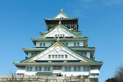 Low angle view of building against blue sky