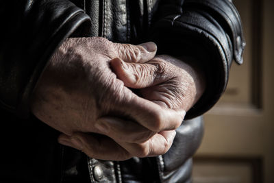 Close-up of man holding hands