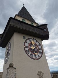 Low angle view of clock tower against sky