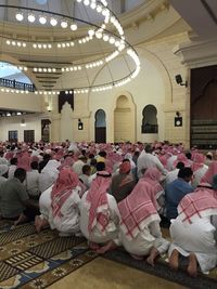 Group of people praying in the mosque