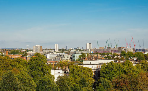 High angle view of trees and buildings against sky