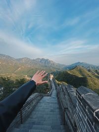 High angle view of person on mountain range against sky