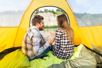 People sitting in tent