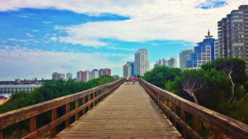 View of city against cloudy sky