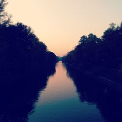 Scenic view of river at sunset