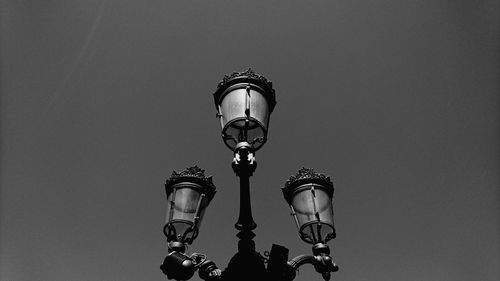 Low angle view of street light against clear sky