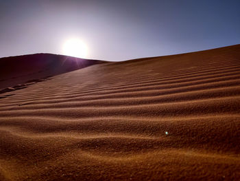 Scenic view of desert against clear sky