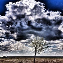 Scenic view of landscape against cloudy sky