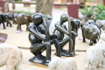 Close-up of statues on table