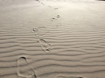 Full frame shot of footprints on sand