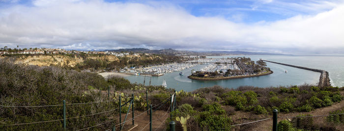 High angle view of bridge over river against cloudy sky