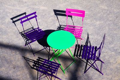 High angle view of empty chairs on table