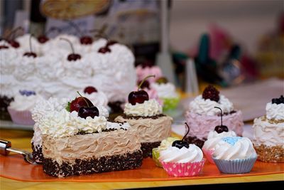 Close-up of fresh cupcakes and cakes at store