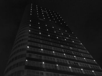 Low angle view of modern building at night