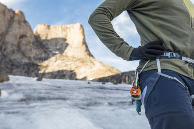 Side view of climber wearing a harness.