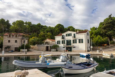 Boats moored at harbor
