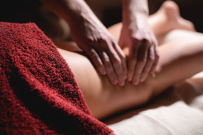 Close-up of woman lying down on bed