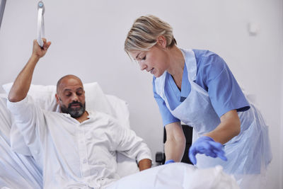 Nurse taking care of patient in hospital