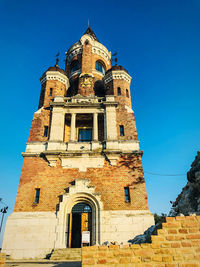 Low angle view of building against blue sky