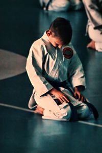 Boy kneeling on floor