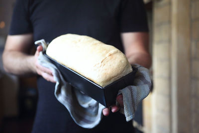 Midsection of man preparing food